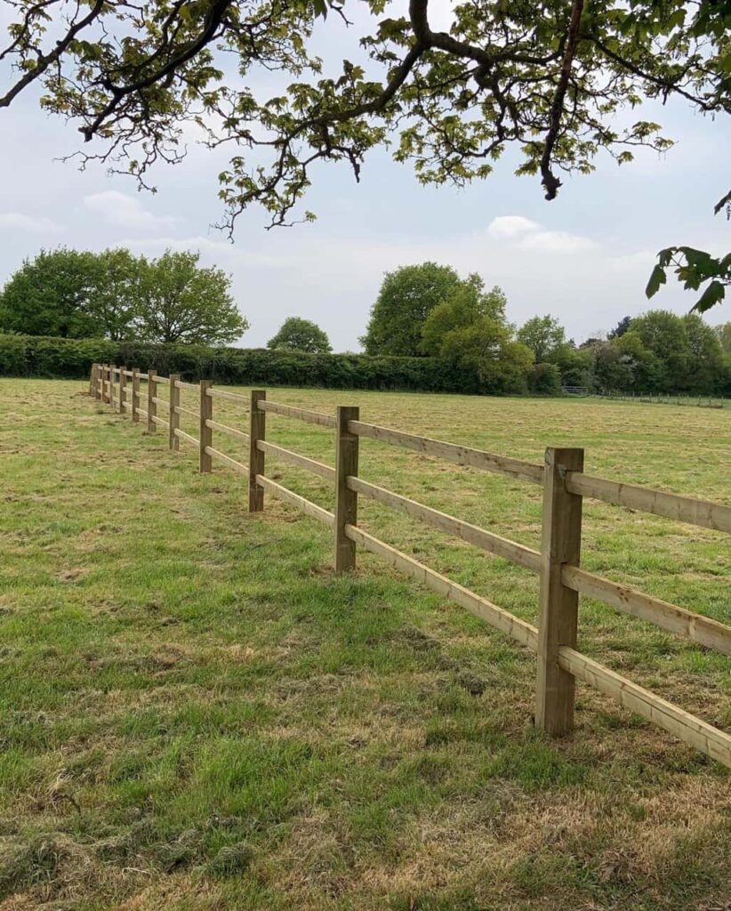 This is a photo of a post and rail fence installed in a field by Fast Fix Fencing Sevenoaks